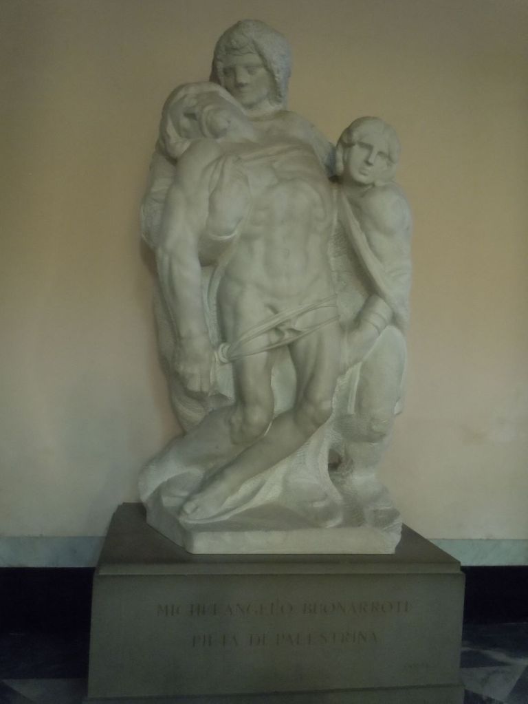 Michelangelo's Pieta of Palestrina. This sculpture group portrays the Virgin and St John the Evangelist holding up the lifeless body of Christ.