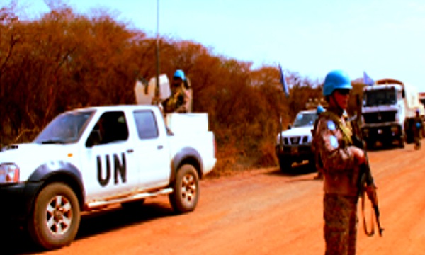 Trucks of UN aid protected by armed peacekeepers